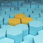 Struttura composta da numerosi esagoni tridimensionali di colore azzurro, con alcuni elementi centrali evidenziati in giallo, a rappresentare anomalie o eccezioni all’interno di un insieme più ampio.